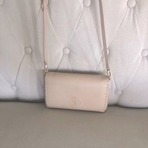 Tory Burch pale pink crossbody bag.